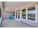 A screened porch with tiled floor, large windows, and comfortable blue seating at 4075 Aspera Dr, Summerville, SC 29483