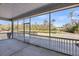 The screened-in porch features a view of the backyard pond at 4075 Aspera Dr, Summerville, SC 29483