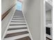 View of wood and white staircase leading up, near the laundry room at 4075 Aspera Dr, Summerville, SC 29483