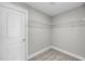 Uncluttered walk-in closet with neutral colored carpet and wire shelving at 4075 Aspera Dr, Summerville, SC 29483