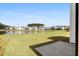 Scenic backyard view overlooking a pond and neighboring homes at 410 Avocet Dr, Summerville, SC 29486