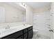 Bathroom featuring a double sink vanity with modern fixtures, a large mirror, and a shower-tub combination at 410 Avocet Dr, Summerville, SC 29486