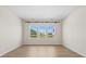Empty bedroom with hardwood floors, bright window and view to the outside and the lake at 410 Avocet Dr, Summerville, SC 29486