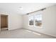 A bright bedroom features carpet, a window and a door to the outside at 410 Avocet Dr, Summerville, SC 29486