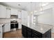 Bright kitchen features stainless steel appliances, white cabinets, granite countertops, and center island at 410 Avocet Dr, Summerville, SC 29486