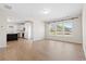Open-concept living area showcasing hardwood floors and a spacious kitchen with modern appliances at 410 Avocet Dr, Summerville, SC 29486