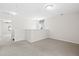 Open loft area offers flexible space with neutral carpet and ample natural light at 410 Avocet Dr, Summerville, SC 29486