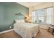 Cozy bedroom with neutral tones, plush carpet, and natural light creating a relaxing retreat at 415 Four Seasons Blvd, Summerville, SC 29486