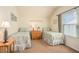 Cozy bedroom featuring two twin beds with matching decor, side table, and natural light at 415 Four Seasons Blvd, Summerville, SC 29486
