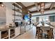 Beautiful community room with open shelving, coffee bar, stainless appliances, and dining area with seating for community events at 415 Four Seasons Blvd, Summerville, SC 29486