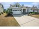 Charming home featuring a two-car garage, and cozy front porch at 415 Four Seasons Blvd, Summerville, SC 29486