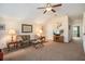 Bright living room showcasing vaulted ceiling, neutral walls, carpet flooring and a ceiling fan at 415 Four Seasons Blvd, Summerville, SC 29486