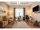 Inviting living room with hardwood floors, comfortable seating, and natural light, creating a cozy atmosphere at 415 Four Seasons Blvd, Summerville, SC 29486