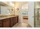 Bright bathroom features a double vanity, walk-in shower, and access to main bedroom at 415 Four Seasons Blvd, Summerville, SC 29486