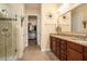 Elegant main bathroom showcases double vanity, walk-in shower, and a walk-in closet at 415 Four Seasons Blvd, Summerville, SC 29486