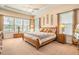 Spacious main bedroom with tray ceiling, carpet flooring, and lots of natural light at 415 Four Seasons Blvd, Summerville, SC 29486