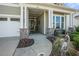 Inviting front porch with elegant columns, decorative heron, and manicured landscaping for charming curb appeal at 415 Four Seasons Blvd, Summerville, SC 29486