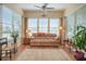 Cozy sunroom with plenty of natural light, comfortable seating, and view of the outdoors at 415 Four Seasons Blvd, Summerville, SC 29486