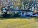 Single-story home with brick facade, green lawn, and attached garage at 4228 Oakridge Dr, North Charleston, SC 29418