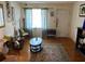 Cozy living room featuring hardwood floors, a patterned rug, and bright natural light at 4228 Oakridge Dr, North Charleston, SC 29418