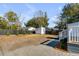 Picture of the spacious backyard with green foliage, a storage shed, and a newly installed fence at 4625 Durant Ave, North Charleston, SC 29405