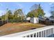 Expansive backyard with a new fence, green trees, and a shed, perfect for outdoor activities at 4625 Durant Ave, North Charleston, SC 29405