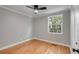 A well-lit bedroom featuring hardwood floors and a modern ceiling fan fixture at 4625 Durant Ave, North Charleston, SC 29405