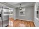 Bright dining space with hardwood flooring and stainless steel refrigerator at 4625 Durant Ave, North Charleston, SC 29405
