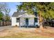 Inviting home featuring a quaint front porch and mature landscaping at 4625 Durant Ave, North Charleston, SC 29405