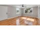Sunlit living room showcasing hardwood floors and a classic white door at 4625 Durant Ave, North Charleston, SC 29405