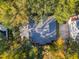 Aerial view of a home with a driveway and a spacious backyard surrounded by mature trees at 5208 Holly Forest, Hollywood, SC 29449