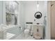 Bathroom with horizontal shiplap, toilet, and vanity with a framed round mirror at 5208 Holly Forest, Hollywood, SC 29449