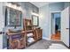 Rustic bathroom with stone vessel sinks, wood cabinets and a modern accent wall at 5208 Holly Forest, Hollywood, SC 29449