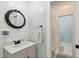 Updated bathroom with shiplap walls, a frameless mirror, and a tiled shower at 5208 Holly Forest, Hollywood, SC 29449