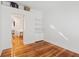Clean, bright room with hardwood floors and neutral walls, featuring built-in shelves and storage at 5208 Holly Forest, Hollywood, SC 29449