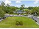 Beautiful clubhouse with manicured lawns and ample parking, set amidst lush greenery and golf course views at 5208 Holly Forest, Hollywood, SC 29449