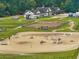 Overview of the Equestrian Center featuring a large riding ring, barns, and surrounding green spaces at 5208 Holly Forest, Hollywood, SC 29449