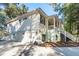 Spacious home with a multi-car garage, dual porches, beautiful lawn and long drive way at 5208 Holly Forest, Hollywood, SC 29449