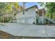 Charming home featuring a spacious three-car garage and a beautifully landscaped yard with mature trees at 5208 Holly Forest, Hollywood, SC 29449