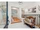 Bright foyer with hardwood floors, staircase, and decorative bench, offering a welcoming entry at 5208 Holly Forest, Hollywood, SC 29449