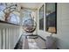 Cozy front porch with hanging chair, providing a relaxing outdoor seating area at 5208 Holly Forest, Hollywood, SC 29449