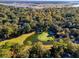 Scenic aerial view of a golf course with a beautiful pond and lush greenery, near waterfront property at 5208 Holly Forest, Hollywood, SC 29449