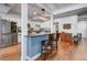 Bright kitchen with a center island, bar stools, and stainless steel appliances at 5208 Holly Forest, Hollywood, SC 29449
