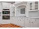 Modern kitchen features sleek white cabinets, stainless steel appliances, and stylish backsplash details at 5208 Holly Forest, Hollywood, SC 29449