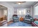 Cozy living room with two comfortable recliner chairs, wood floors, and a round rug at 5208 Holly Forest, Hollywood, SC 29449