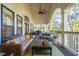 Inviting outdoor porch with comfortable seating and views of the surrounding trees at 5208 Holly Forest, Hollywood, SC 29449