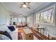 Relaxing sunroom with comfortable sofa seating and an adjacent dining table at 5208 Holly Forest, Hollywood, SC 29449