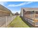 Fenced backyard, offering security, features a wooden deck, and a well-kept lawn at 5286 Waterview Dr, North Charleston, SC 29418