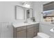 Well-lit bathroom featuring modern vanity, white countertops, and large rectangular mirror at 5286 Waterview Dr, North Charleston, SC 29418