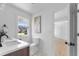 Bathroom featuring double sinks, modern fixtures, and a window with neighborhood views at 5286 Waterview Dr, North Charleston, SC 29418